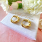 Gold twist Rope Huggie earrings.