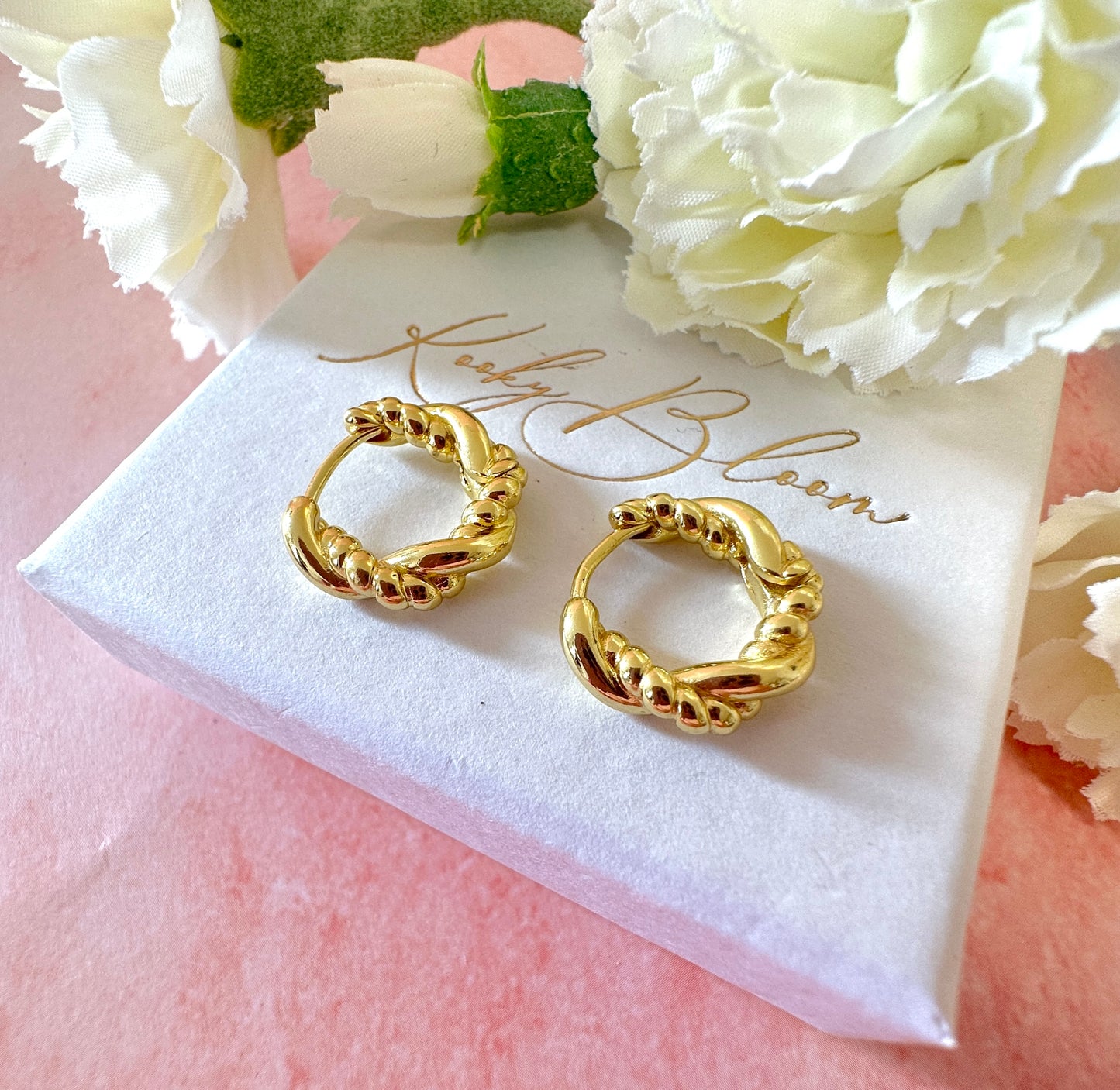 Gold twist Rope Huggie earrings.