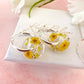 Yellow blossom bloom flower donut earrings.