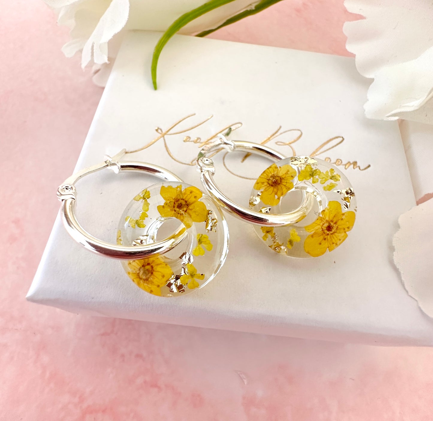 Yellow blossom bloom flower donut earrings.