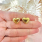 Gold puff heart stud earrings.