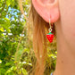 Tiny enamel Strawberry gold huggie earrings.