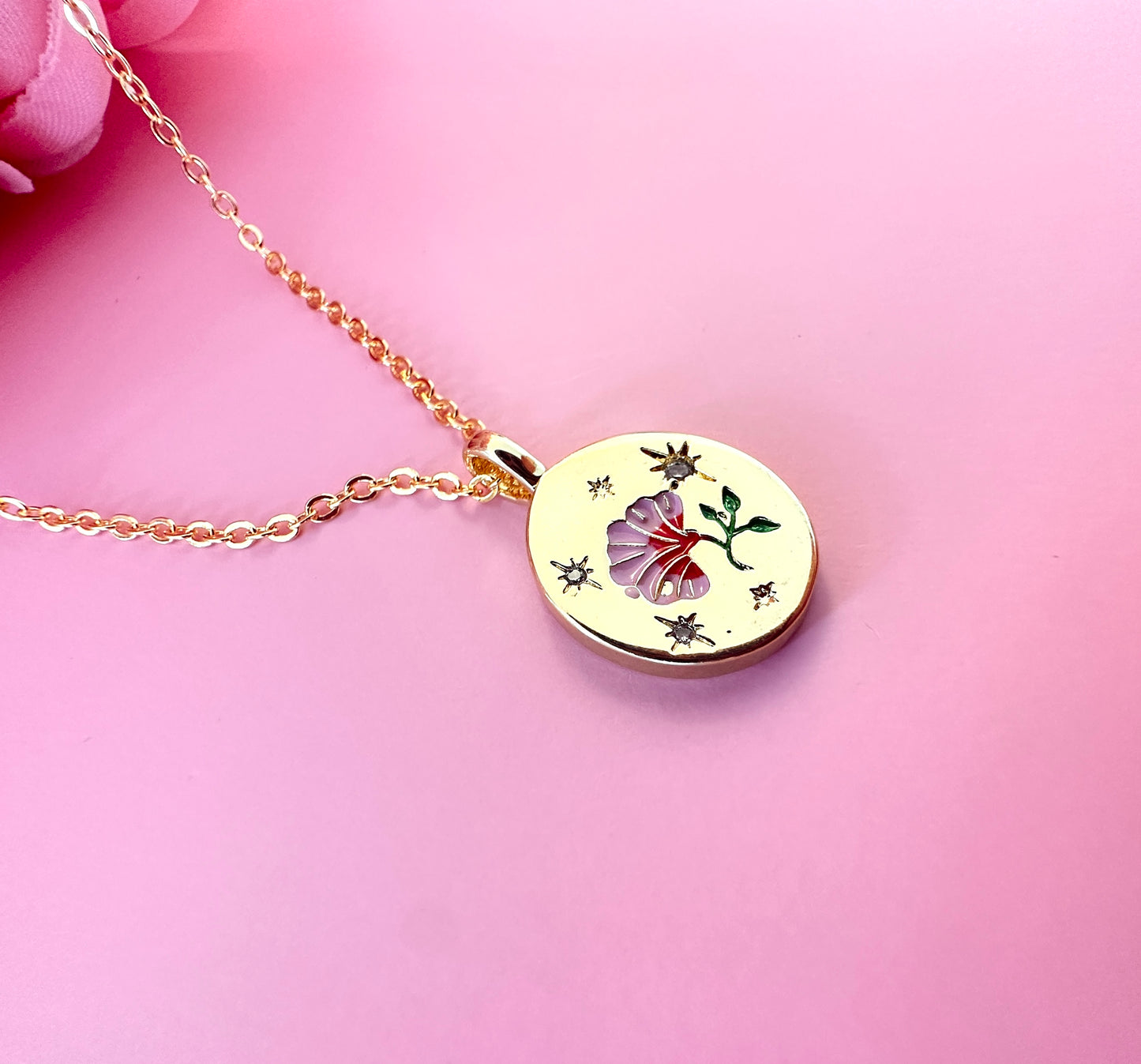 Gold Pink engraved Flower necklace.