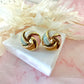 Gold Enamel Knot oversized stud earrings.