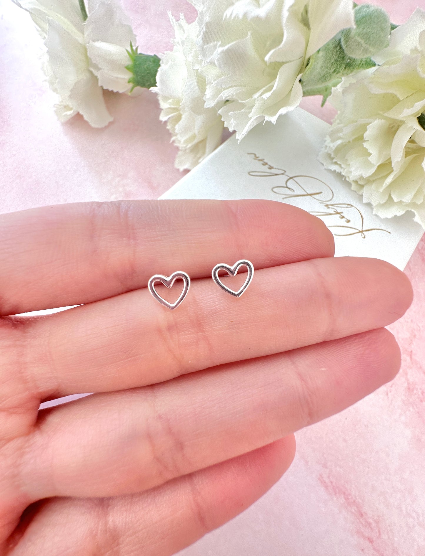 925 Sterling silver Hollow Heart stud earrings.