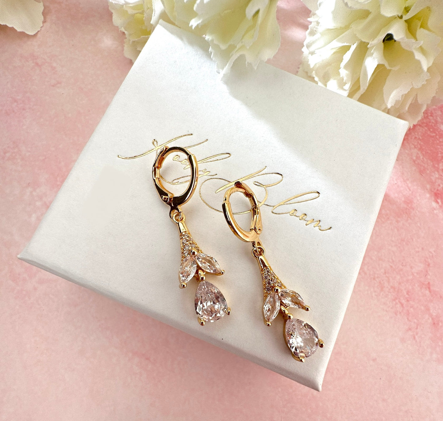 Gold CZ Flower drop Huggie earrings.