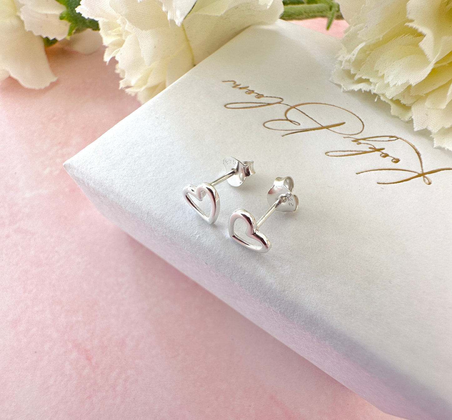 925 Sterling silver Hollow Heart stud earrings.