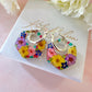 Colourful flower hexagon bloom earrings.