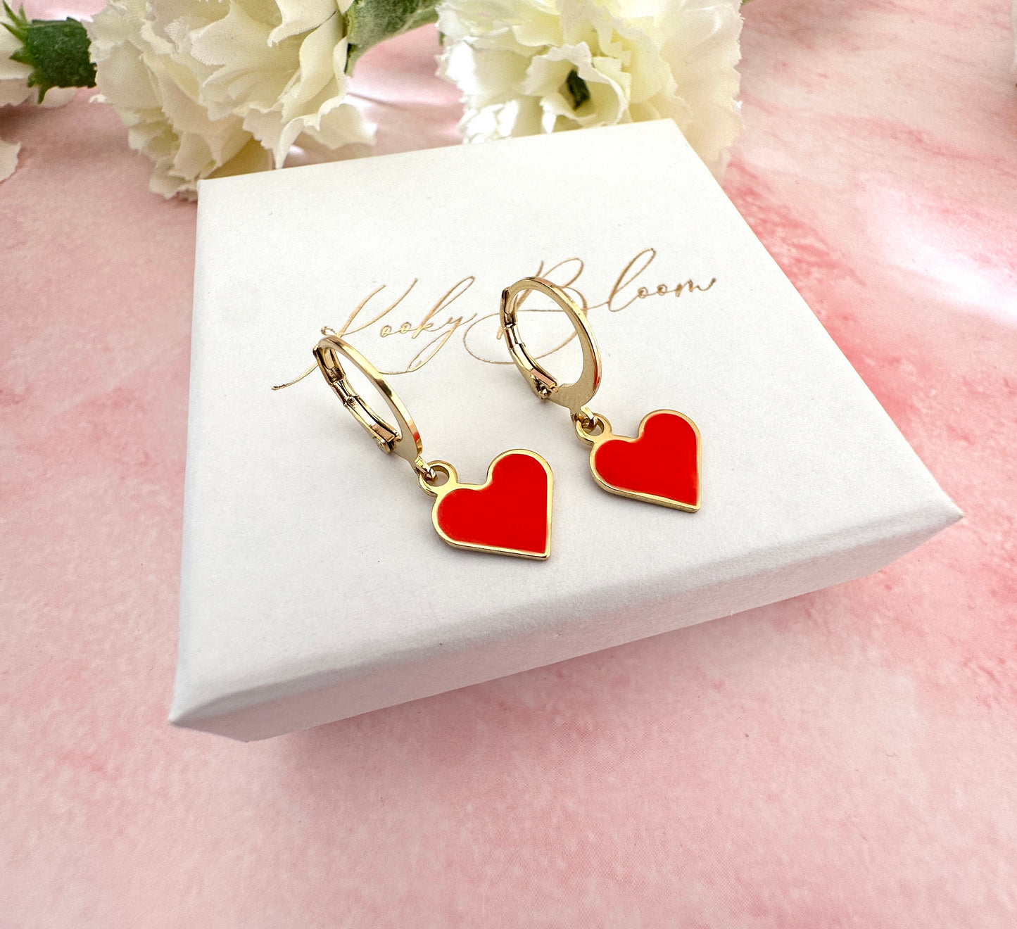 Gold Enamel Heart Huggie earrings.