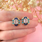 Gold Aztec Blue Diamanté stud earrings.