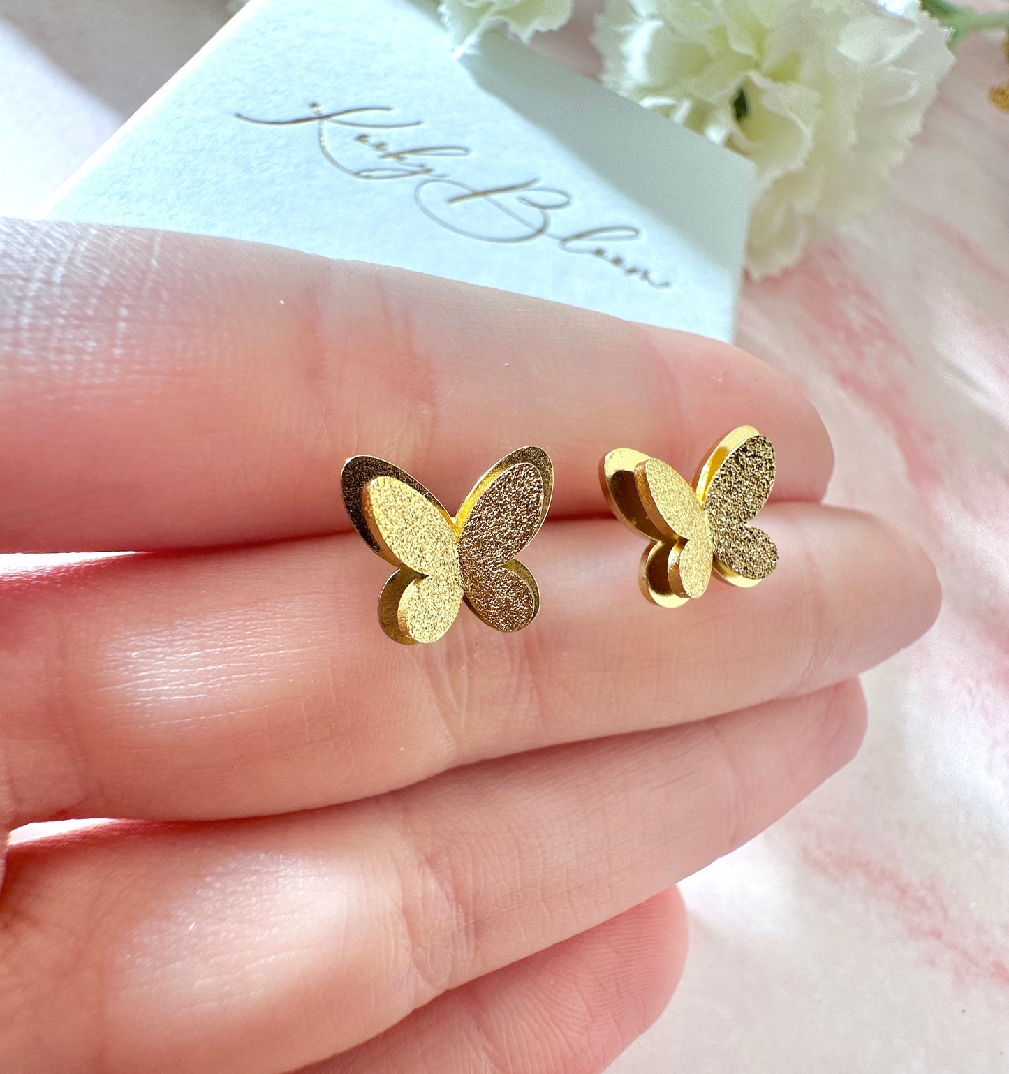 Gold 3d Butterfly stud earrings.