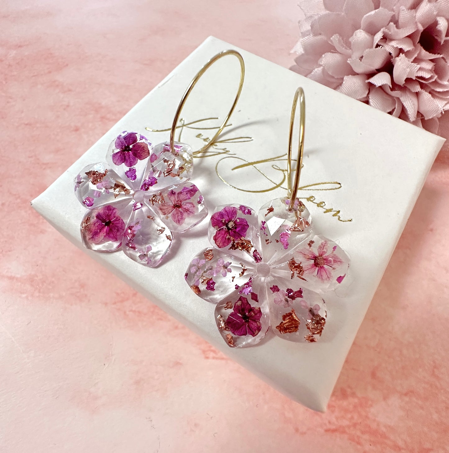 Plumb Blossom diamond cut flower earrings.