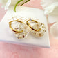 White blossom bloom flower donut earrings.