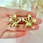 Gold oversized star Flower stud earrings.