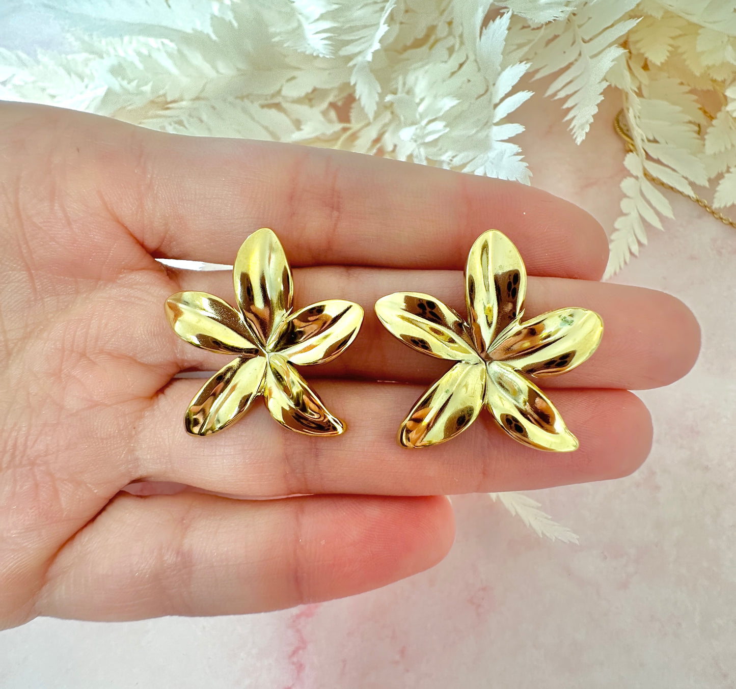 Gold oversized star Flower stud earrings.