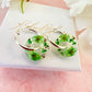 Green blossom bloom flower donut earrings.