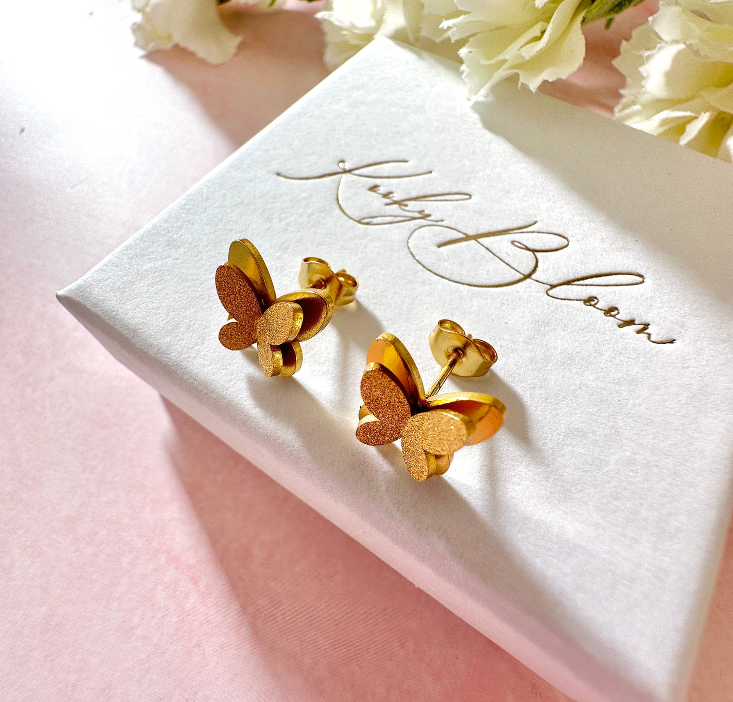 Gold 3d Butterfly stud earrings.