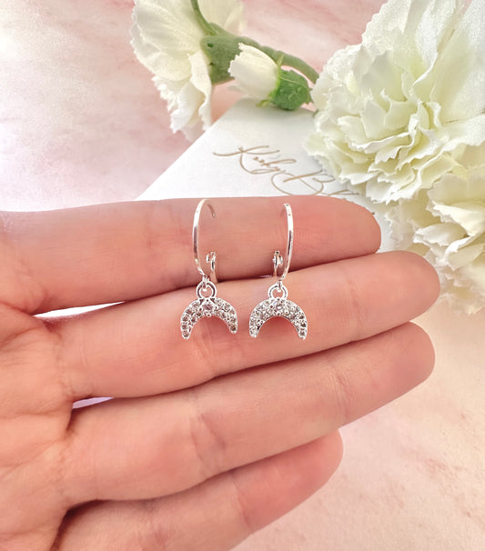 Diamanté Crescent Silver huggie hoop earrings.