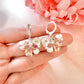 Flower & Pearl Bow bloom Silver Huggie earrings.