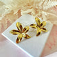 Gold oversized star Flower stud earrings.