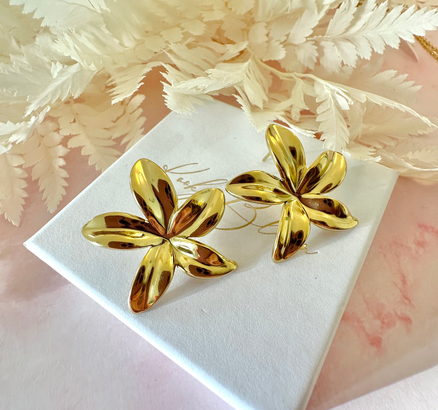 Gold oversized star Flower stud earrings.