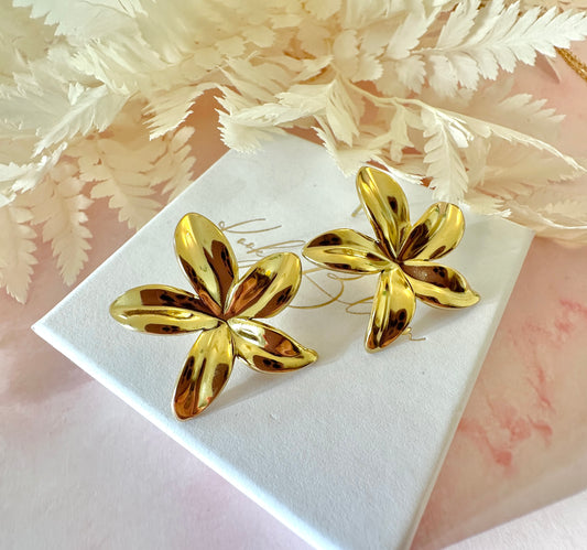 Gold oversized star Flower stud earrings.