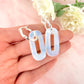 Silver Opalite gemstone twist hoop earrings.