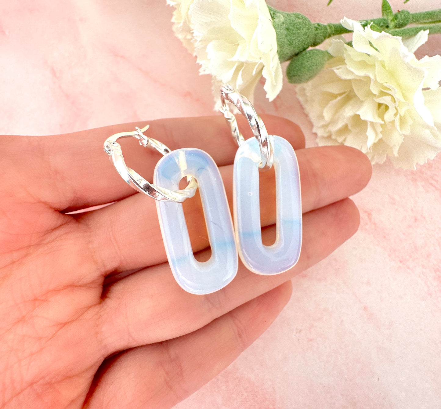 Silver Opalite gemstone twist hoop earrings.