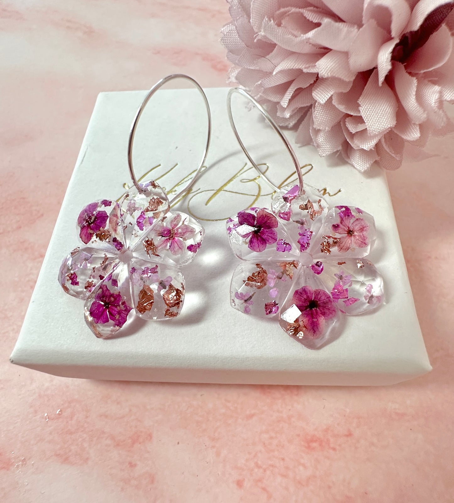 Plumb Blossom diamond cut flower earrings.