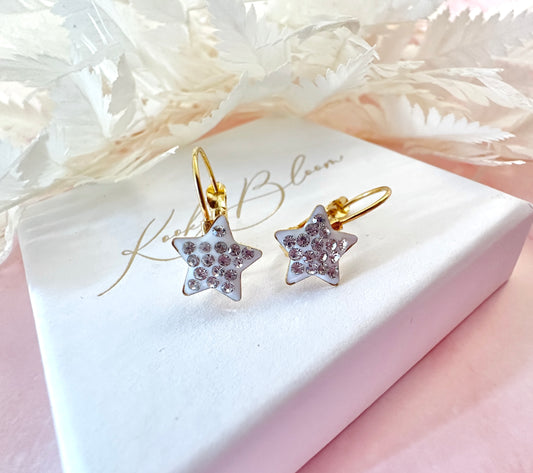 Gold White Diamanté Star leverback earrings.