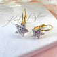 Gold White Diamanté Star leverback earrings.