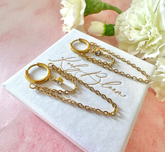 Gold Double chain drape Huggie earrings.