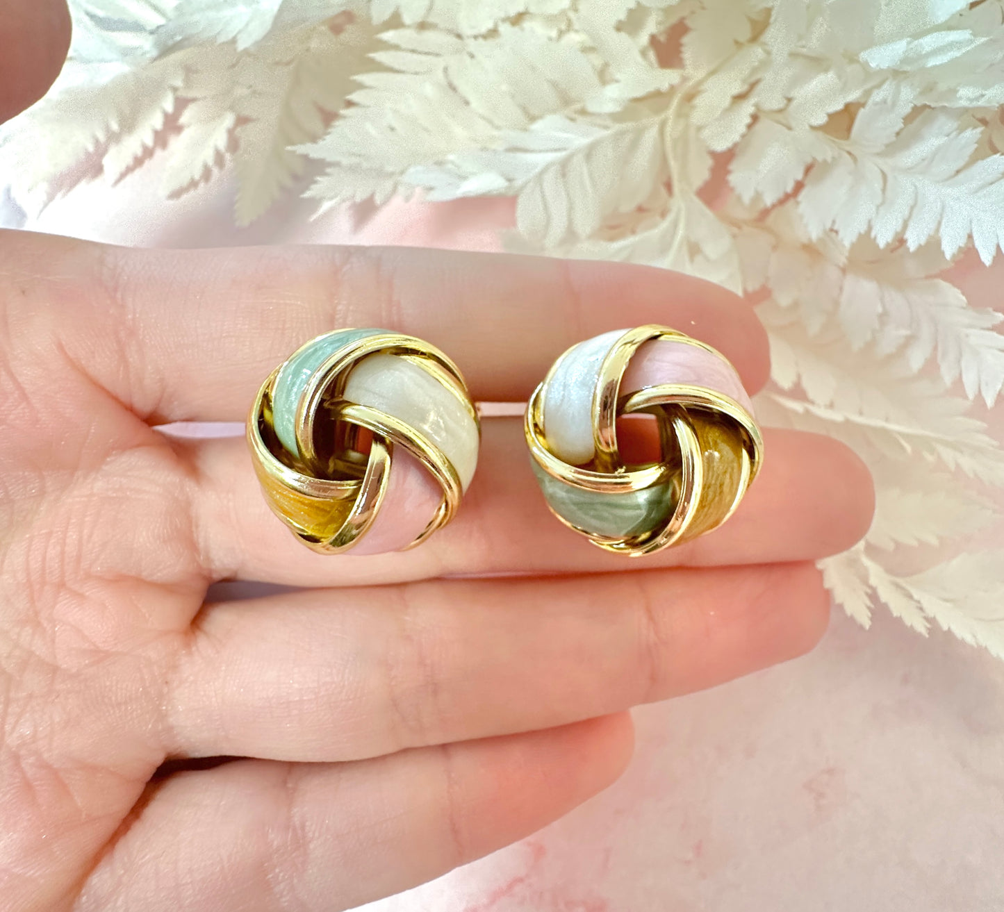 Gold Enamel Knot oversized stud earrings.