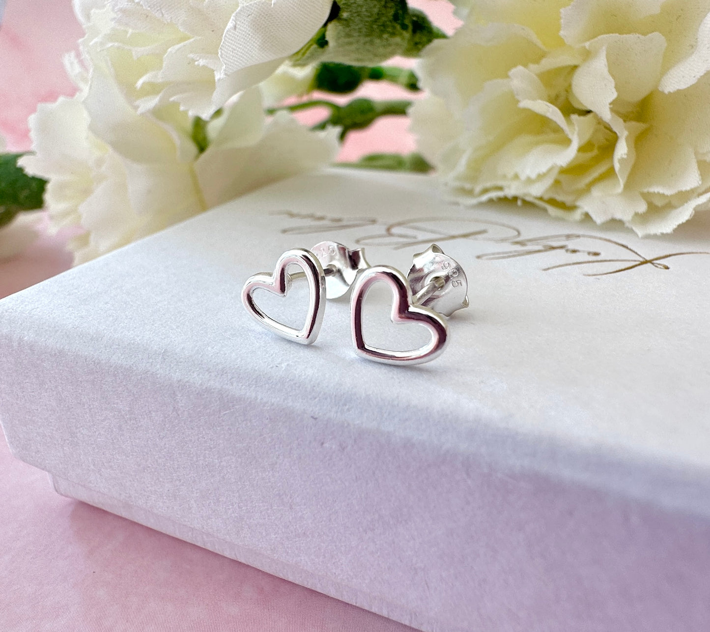 925 Sterling silver Hollow Heart stud earrings.