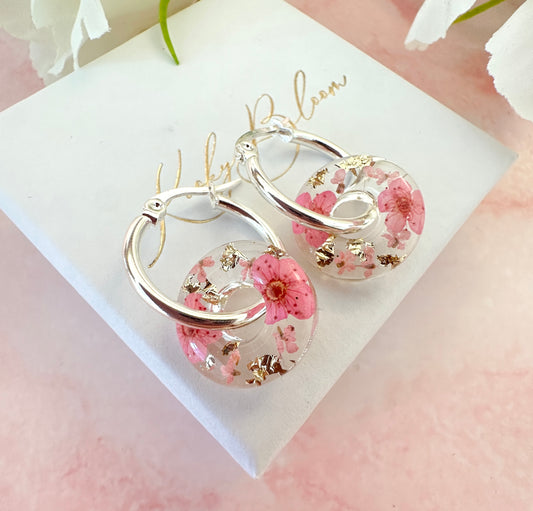 Pink blossom bloom flower donut earrings.