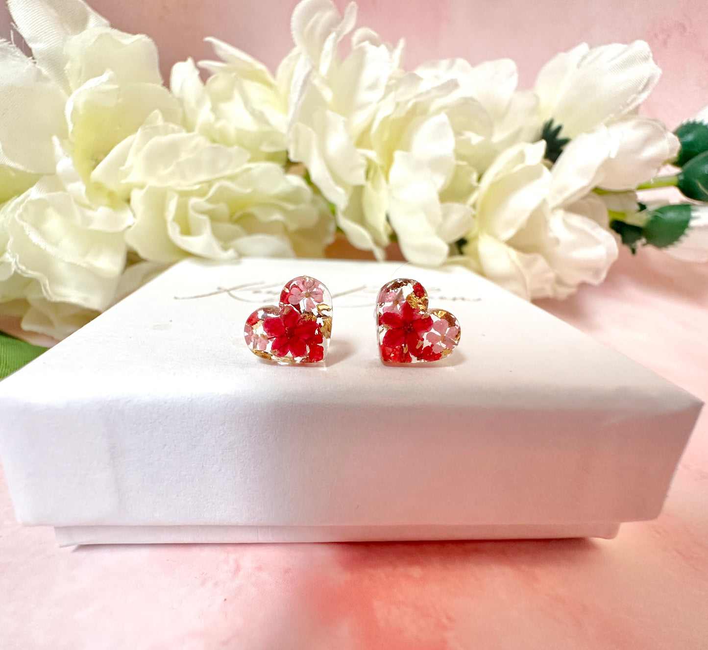 Tiny valentines Bloom Heart Sterling silver stud earrings.