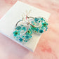 Turquoise Aqua flower bloom donut earrings.