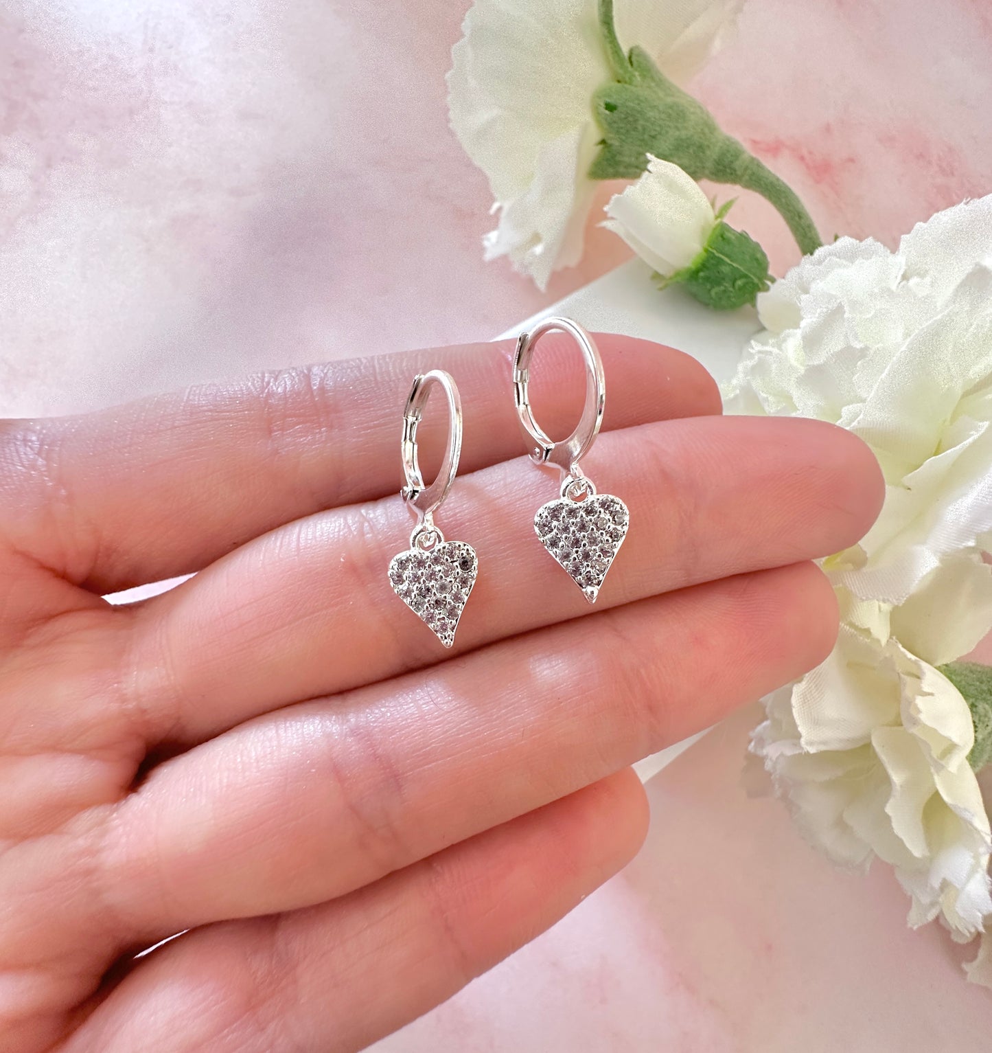 Cz Heart Silver huggie hoop earrings.