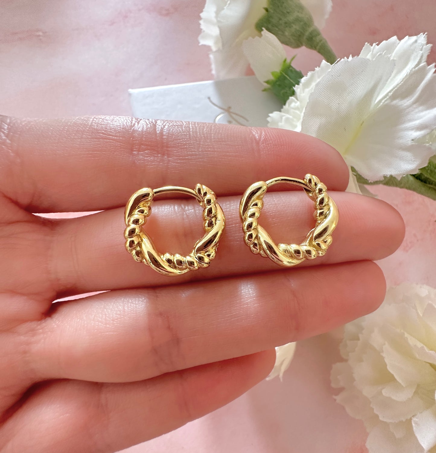 Gold twist Rope Huggie earrings.