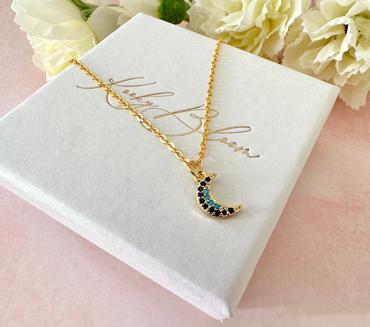 Gold tiny blue stone Moon Necklace.