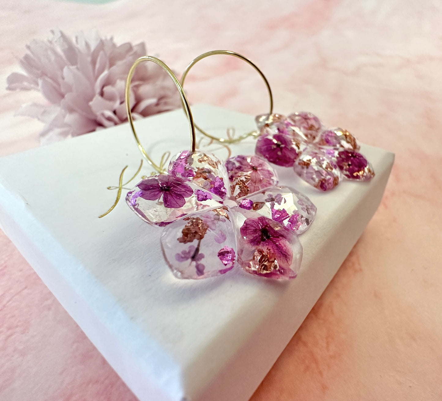 Plumb Blossom diamond cut flower earrings.