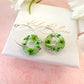 Green blossom bloom flower donut earrings.