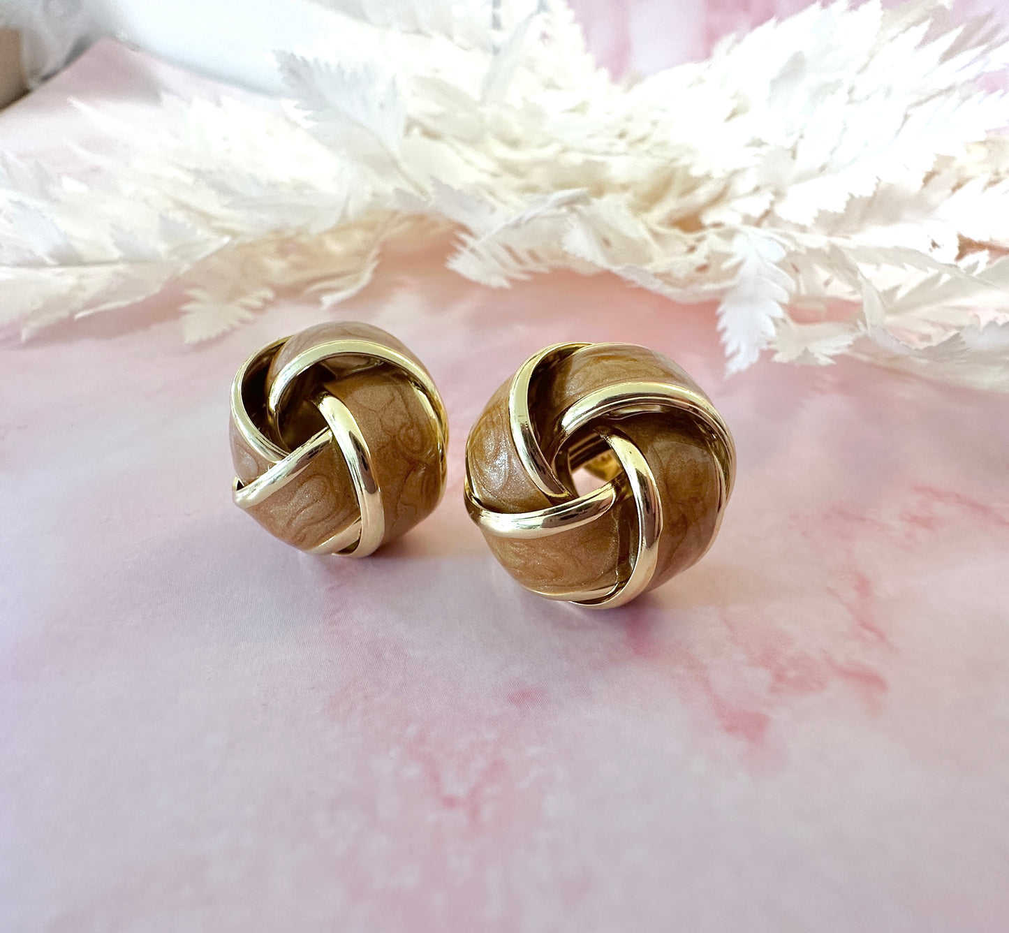 Gold Enamel Knot oversized stud earrings.