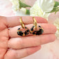 Black flower Retro Nugget bloom earrings.