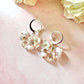 Flower & Pearl Bow bloom Silver Huggie earrings.