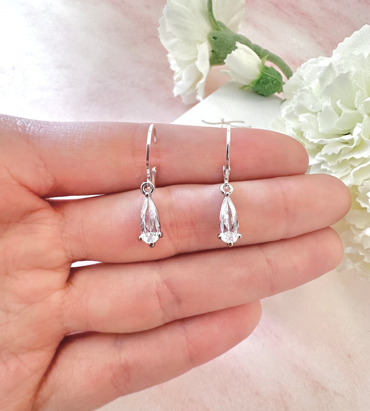 CZ Teardrop Silver huggie hoop earrings.