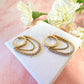 Gold CZ chain Huggie hoop earrings.