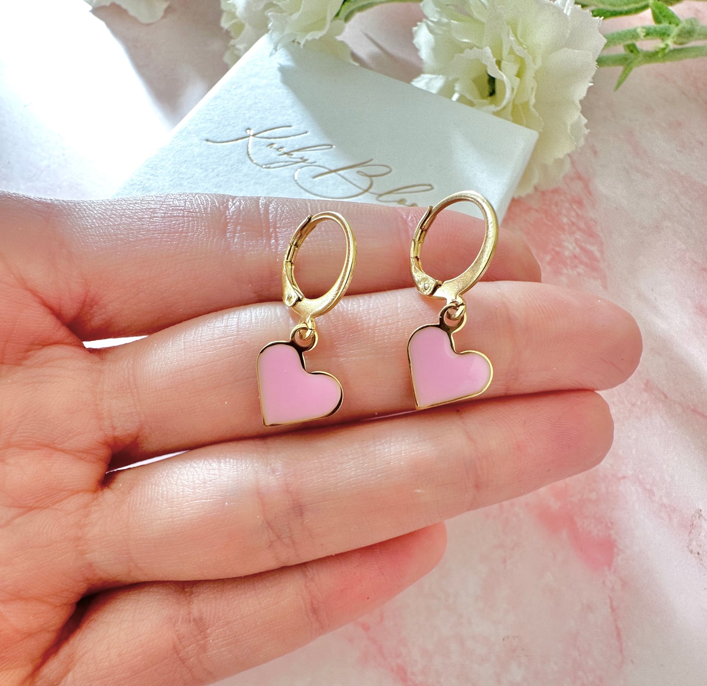 Gold Enamel Heart Huggie earrings.