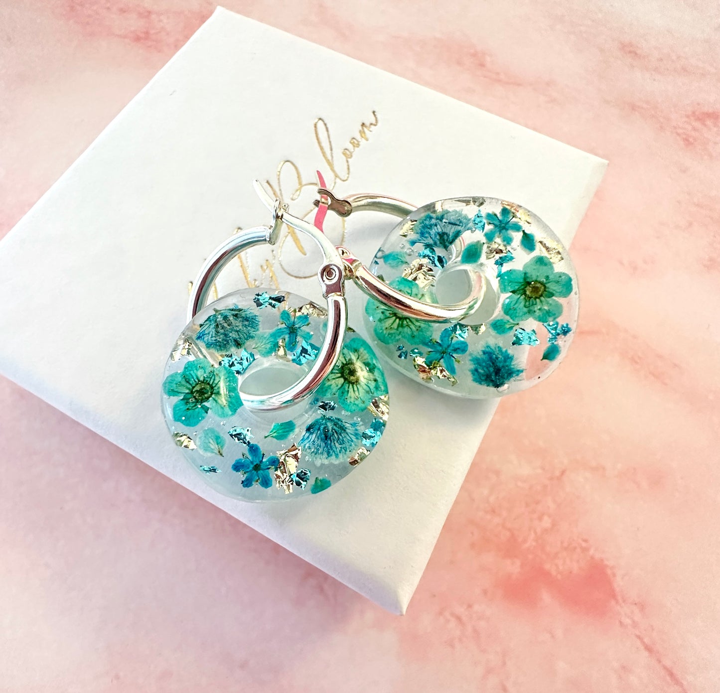 Turquoise Aqua flower bloom donut earrings.