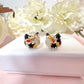 Cat real flower sterling silver stud earrings.